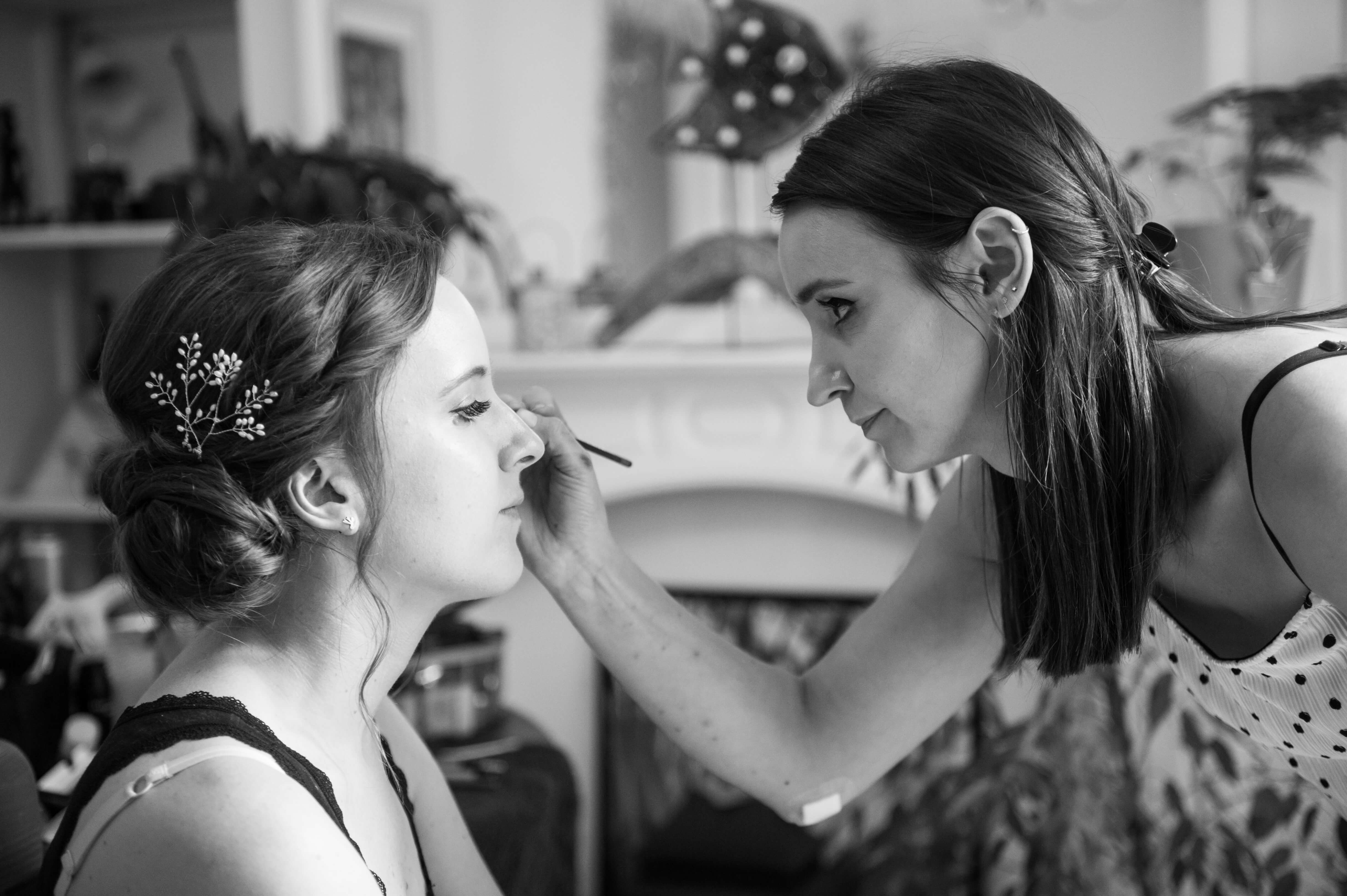 A bride having her make up done by Liz Patey